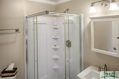 Second bathroom has shower stall.