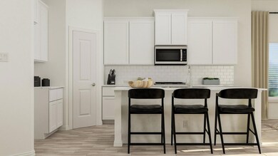 Kitchen with white cabinetry, light wood-type floo