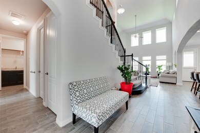 Entryway leads to office and downstairs secondary bedroom