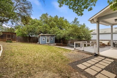 View of yard with an outdoor structure, a wooden 
