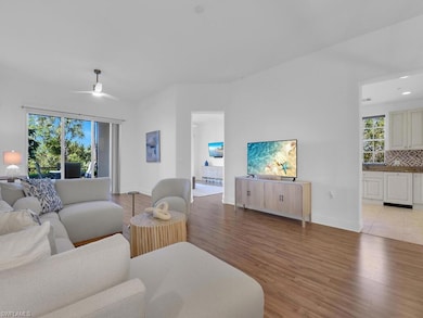 Living area with baseboards, ceiling fan, recessed lighting, and light wood-type flooring