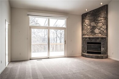 The family room has new neutral wall to wall carpe