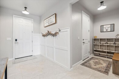 Mudroom with accent wall hangers