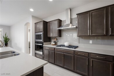 Dark cabinetry, upgraded backsplash
