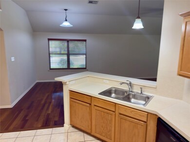 Kitchen featuring decorative light fixtures, ligh