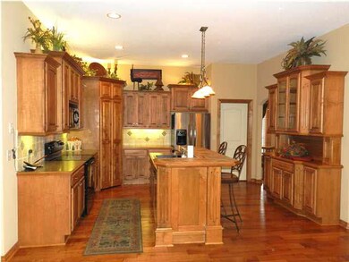 THE KITCHEN HAS AN ABUNDANCE OF MAPLE CABINETS INC