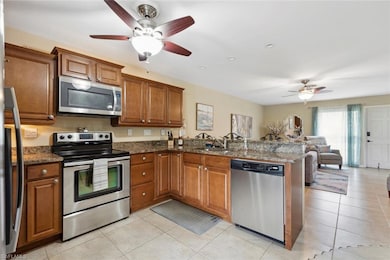Kitchen with ceiling fan, appliances with stainles