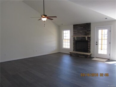 Picture of similar home built. Family room with stone wall gas fireplace.