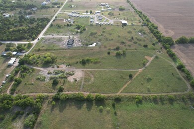 Birds eye view of property with a rural view