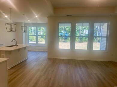 Doorway to outside featuring recessed lighting and wood finished floors