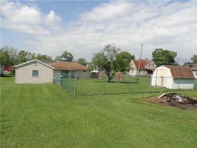 Yard/Garden. Back view with partially fenced yard.