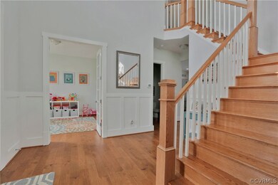Full oak stairs, notice mill work detail in foyer,