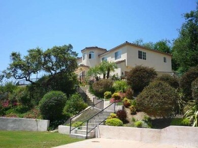 View of house from lower yard/patio area