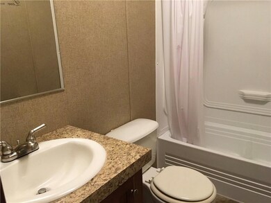 Bathroom with vanity and shower / tub combo
