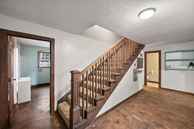 Stairway with a textured ceiling