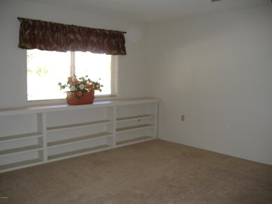 LIVING ROOM WITH BOOKCASES