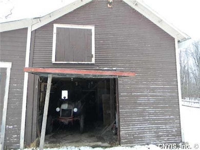 Stable/Barn. Lots of room for toys,cars,equipment.