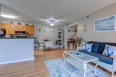 Living room with light wood-type flooring and ceil