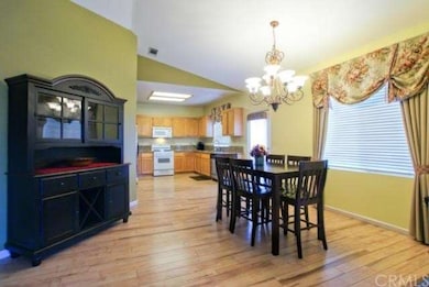 Open Dining Room Adjacent to Kitchen and Family Ro