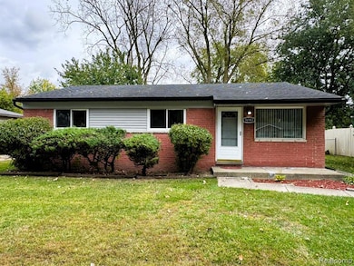 Ranch-style home with brick siding