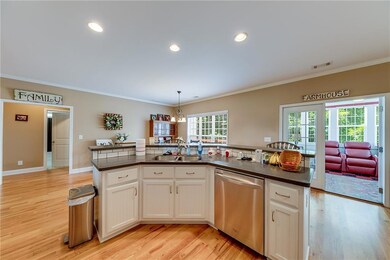 Kitchen featuring plenty of natural light, dishwas