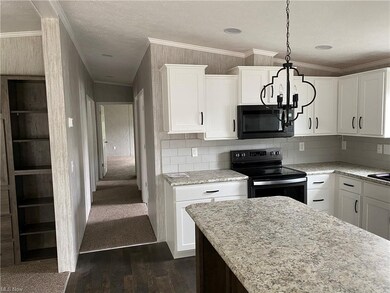 Spacious Kitchen with Decorative lighting over the
