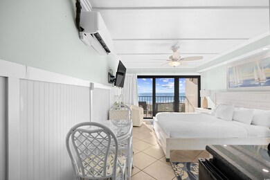 Bedroom with tile patterned floors, a wall mounted AC, access to outside, ceiling fan, and crown molding