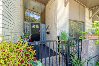 Doorway to 11419 with covered porch