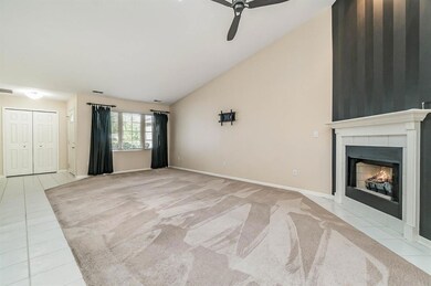OPEN CONCEPT LIVING ROOM WITH FIREPLACE