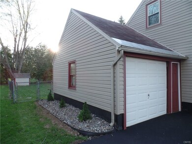 New landscaping along the garage leads to the full