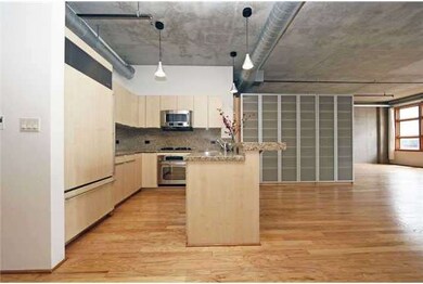 The kitchen features gleaming granite countertops 