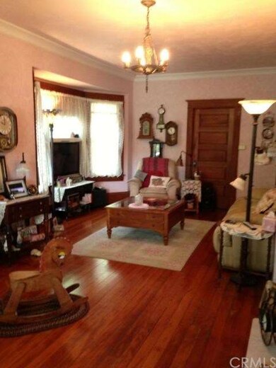 Large living area. Original hardwood floors.