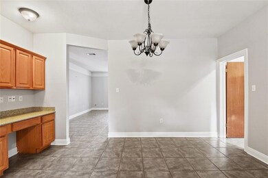 Dining Area and Desk.  Laundry area is through the