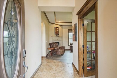 View from the front door looking into the living room. French door on the right leads to the office/study.