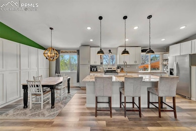 Custom cabinets, a huge center island, open shelvi