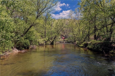 Property view of water featuring a view of trees