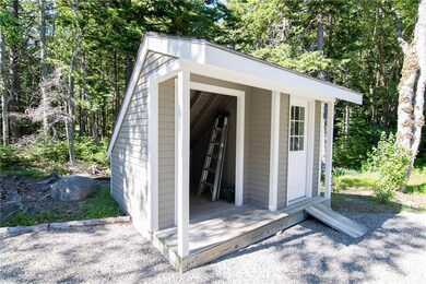 Real nice wood shed and storage.