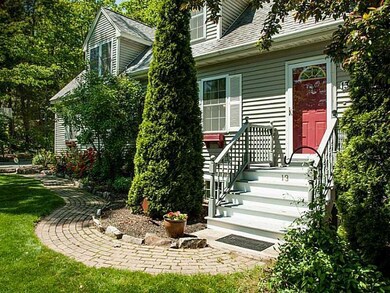 Exterior Front. Landscaping reflects...