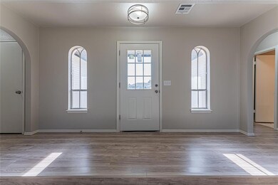Entrance foyer featuring light hardwood / wood-sty