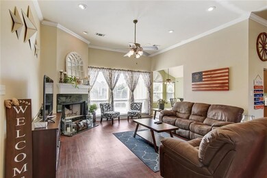 Spacious family room with fireplace and wall of wi