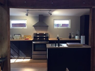 Butcher block countertop and ss appl  iances, load