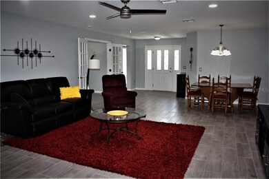 OPEN AND AIRY FORMAL DINING AREA AND GREAT ROOM WH