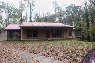 View of front of home with a sunroom