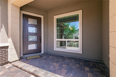 View of exterior entry featuring stucco siding