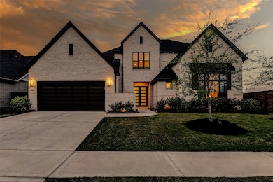 The extended double-wide driveway leads to a spaci