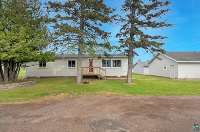 View of front of house with crawl space and a front yard
