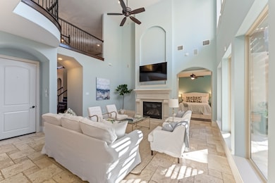 The family room's fireplace mantle with large inlay is perfect for displaying artwork or a TV. This room, like the rest of the home, showcases high-quality finishes and thoughtful architectural details that continue throughout the home.