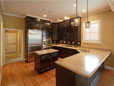 The painted cabinets,granite and backsplash combin