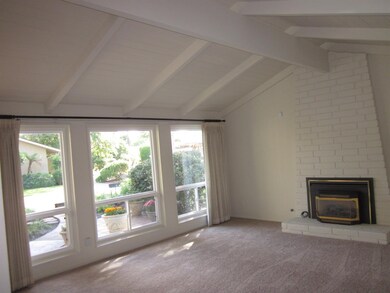Step-Down living room with vaulted ceilings, gas i