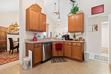 Kitchen with pendant lighting, high vaulted ceilin